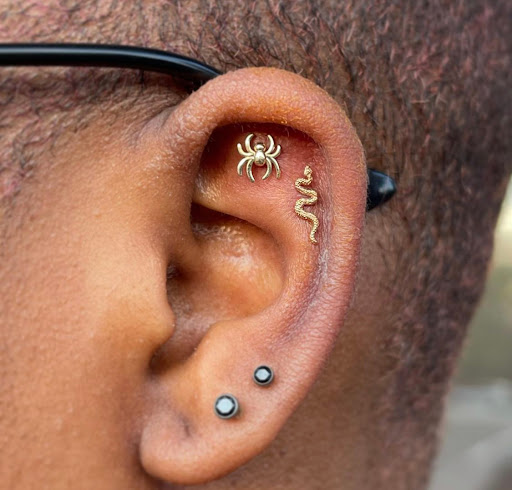 Explore small frog tattoo ideas, creative tattoo ideas in Marietta, available at The Queen Bee Tattoo and Piercing Parlour