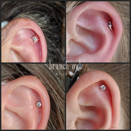 Explore back flower tattoo ideas, creative tattoo ideas in Brighton, available at Branch Out Studios - Tattoo & Piercing Lounge