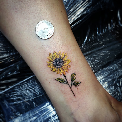 Find charm bracelet tattoo ideas for your next unique tattoo in Debary at Divine Line Tattoos