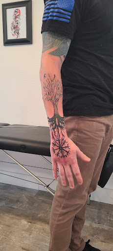 Explore tattoo hand ideas, creative tattoo ideas in Stevens Point, available at Against All Odds Tattoo
