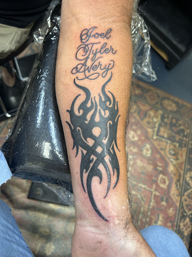 Explore tattoo word cover up ideas, creative tattoo ideas in Marietta, available at Lure Tattooing & Piercing LLC