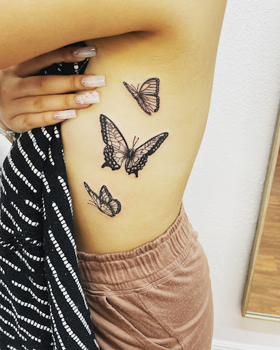 Explore bikini tattoo ideas, creative tattoo ideas in Cocoa, available at Rorschach Tattoo Shop and Piercing Studio