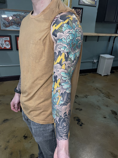 Explore fishing tattoo ideas for men, creative tattoo ideas in Tacoma, available at Ninth Tentacle Tattoo
