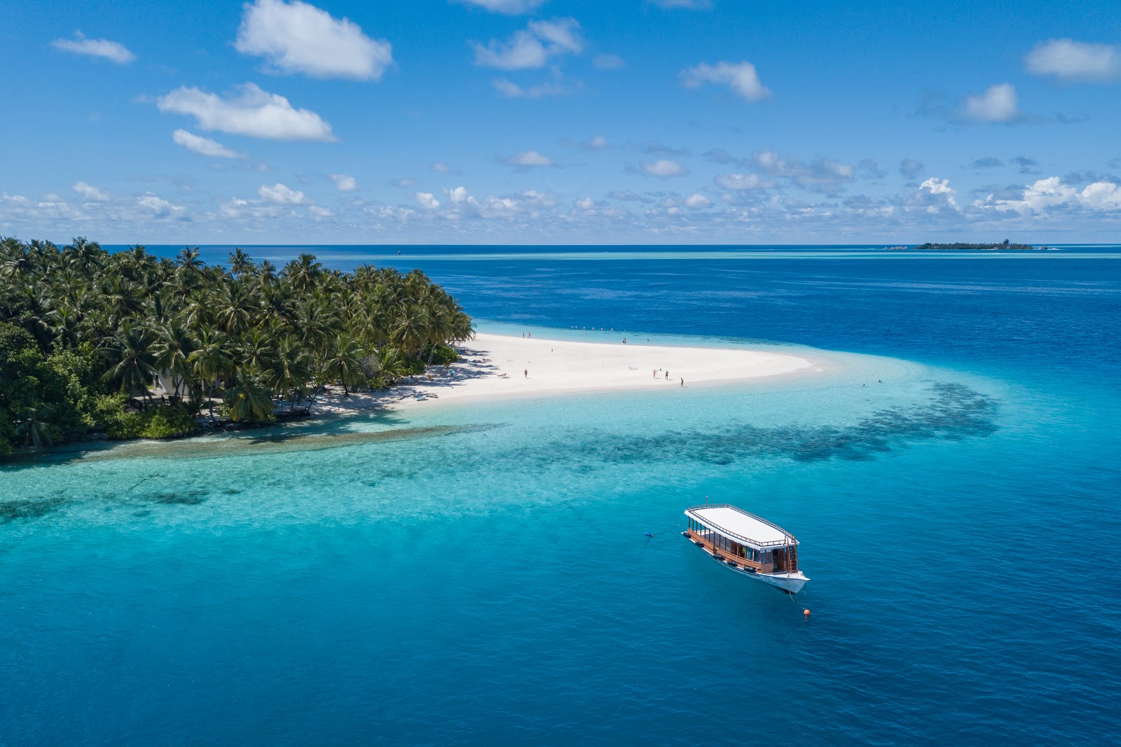 Photo of Fihalhohi Island Resort with turquoise pure water surface