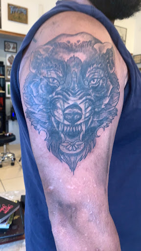 Explore hell hound tattoo ideas, creative tattoo ideas in Newburgh, available at Outlaw Ink