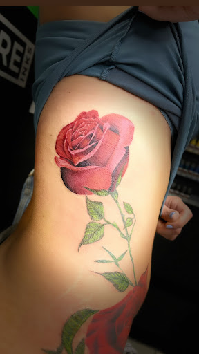 Explore tattoo ideas for women flowers, creative tattoo ideas in Cadillac, available at Limitless Ink Tattoo Studio