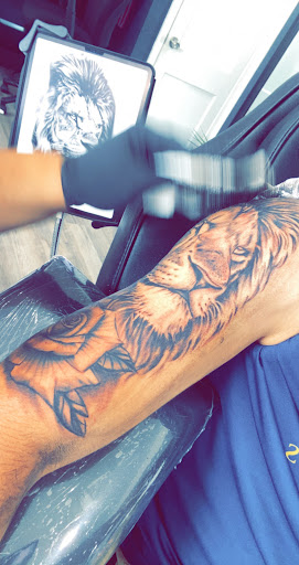 Explore red hand tattoo ideas, creative tattoo ideas in Alexandria, available at La Casa de Tinta