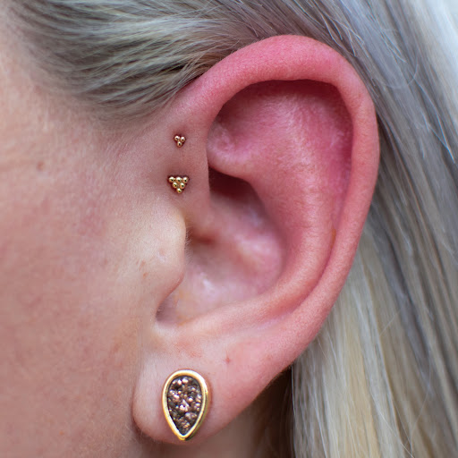 Explore womens sternum tattoo ideas, creative tattoo ideas in Seattle, available at Laughing Buddha Seattle