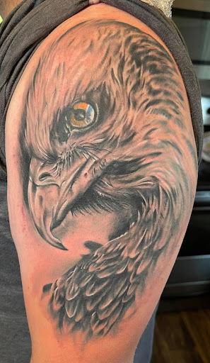 Explore torn skin tattoo ideas, creative tattoo ideas in Mayodan, available at Bleeding Ink Tattoo