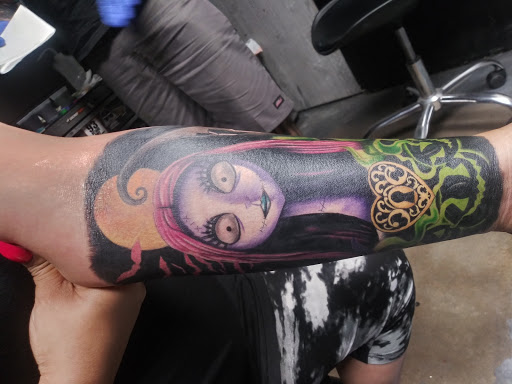 Explore middle of boob tattoo ideas, creative tattoo ideas in Odessa, available at Black Cat Tattoo Company