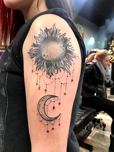 Explore rose and butterfly tattoo ideas, creative tattoo ideas in Frankfort, available at The Reef Tattoo