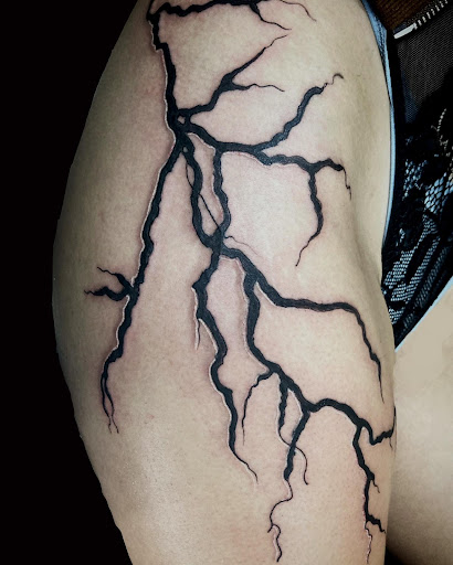 Find cute bear tattoo ideas for your next unique tattoo in Cocoa at Rorschach Tattoo Shop and Piercing Studio