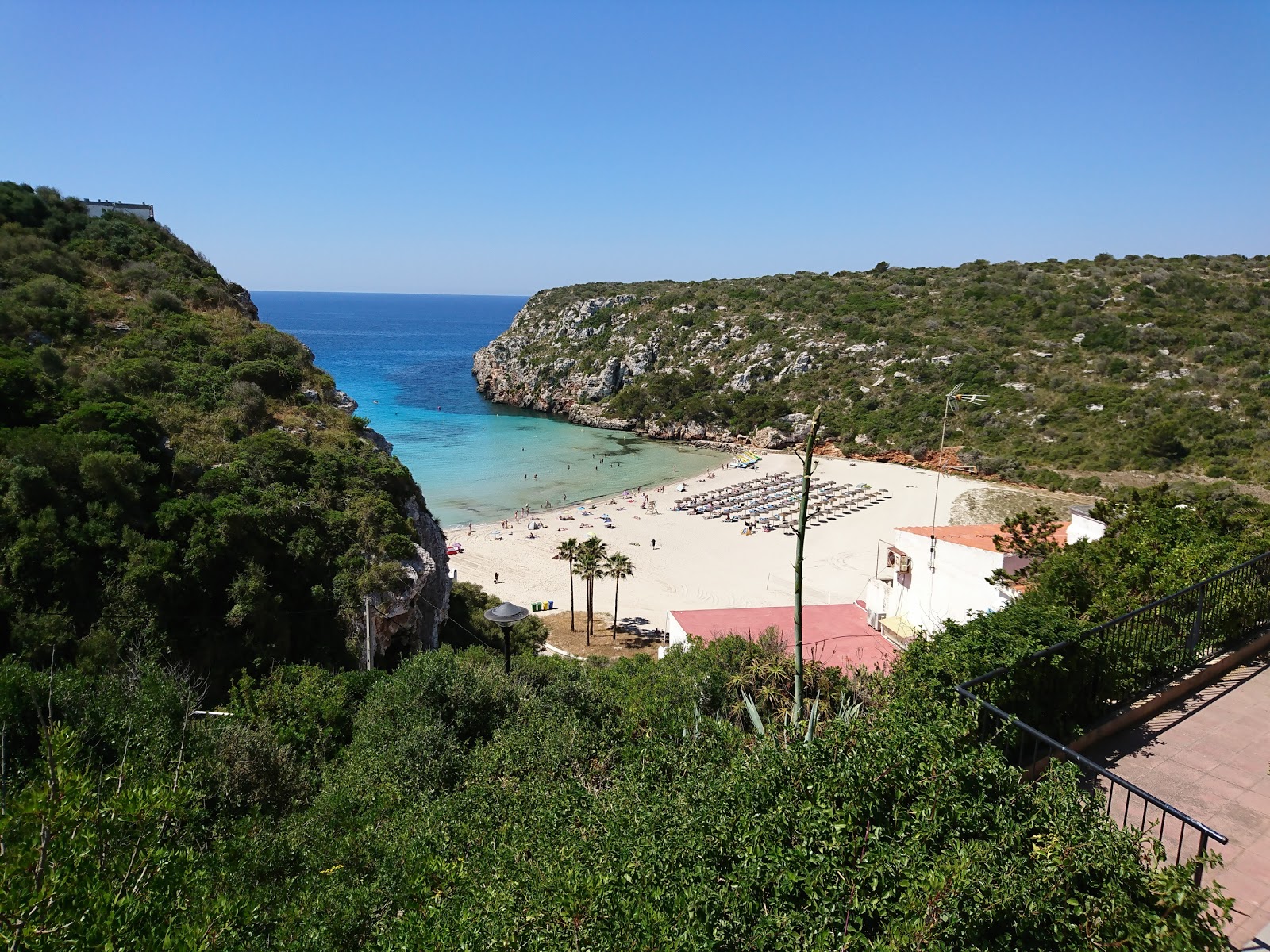 Photo of Cala en Porter beach with turquoise pure water surface