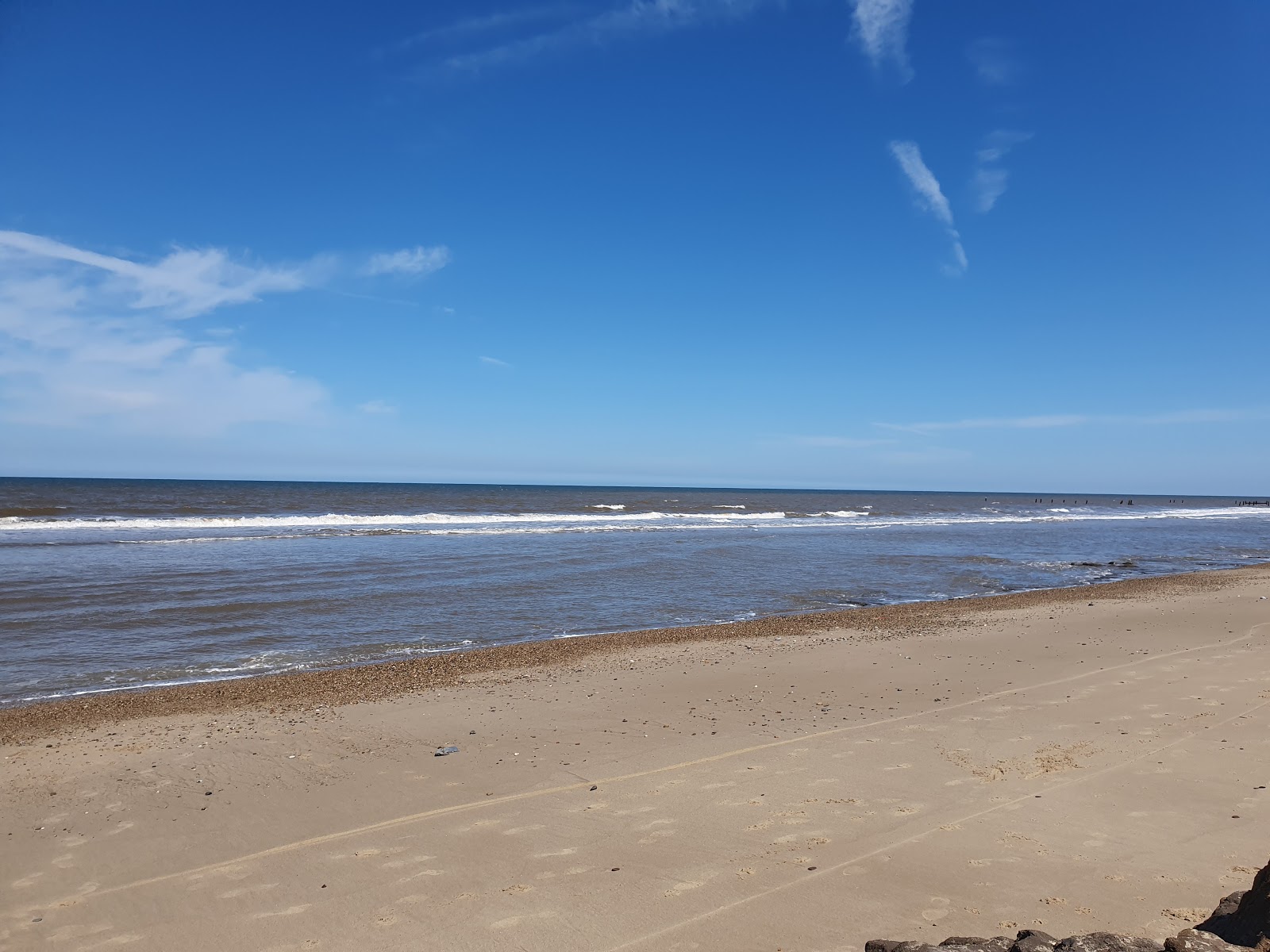 Foto af Happisburgh Strand med lang lige kyst