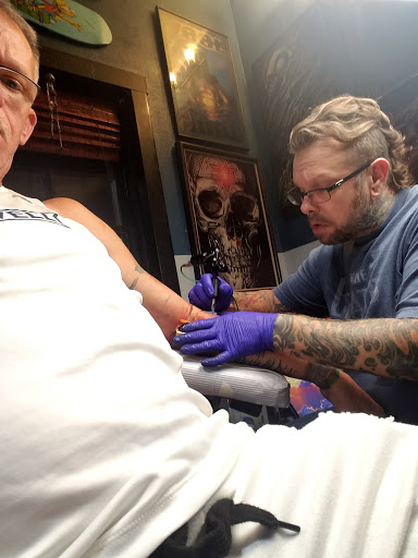 Explore feminine half sleeve tattoo ideas, creative tattoo ideas in Belleville, available at Integrity Tattoos