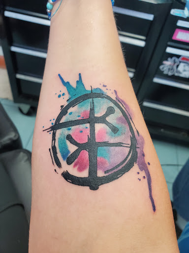 Explore gladiolus tattoo ideas, creative tattoo ideas in Hampton, available at Blue Horseshoe Tattoo and Body Piercing