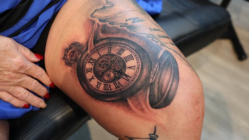 Explore mother son tattoos ideas, creative tattoo ideas in Lakeland, available at Lyons Den Tattoo Company