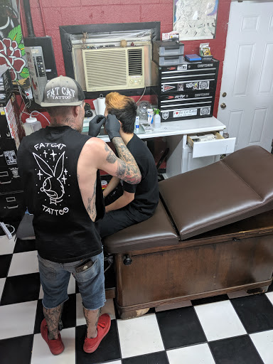 Explore sleeve tattoo fill in ideas, creative tattoo ideas in Carmichael, available at Fat Cat Tattoo Parlour