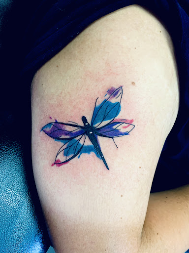 Explore tattoo ideas from books, creative tattoo ideas in Lake City, available at Crooked Spines Tattoo Studio