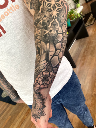 Explore tree tattoo sleeve ideas, creative tattoo ideas in Tacoma, available at Tsunami Tattoo