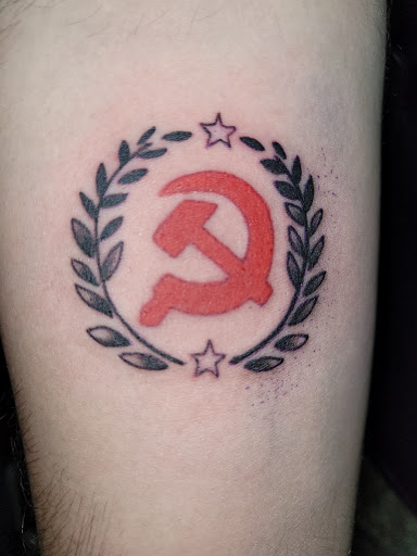 Explore half sleeve tattoo ideas men, creative tattoo ideas in Angola, available at Hoodlum Ink