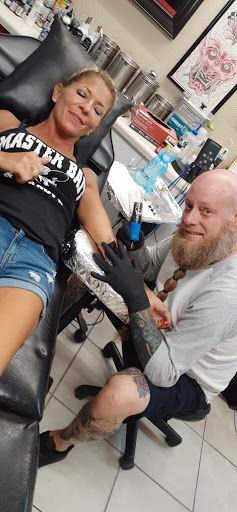 Explore pinup tattoo ideas, creative tattoo ideas in Clearwater Beach, available at Psychotic Ink