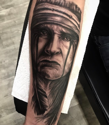 Explore indian chief tattoo ideas, creative tattoo ideas in Johnson City, available at Gold Cross Tattoo Co.
