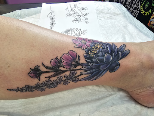 Explore march birth flower tattoo ideas, creative tattoo ideas in Barberton, available at Magic City Tattoo Company