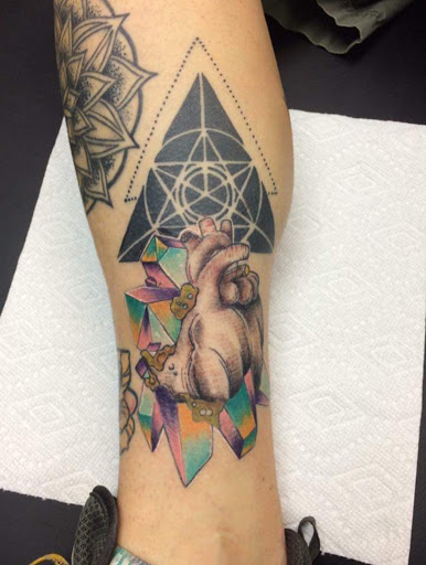 Explore skull and crossbones tattoo ideas, creative tattoo ideas in Loveland, available at Satori Tattoo