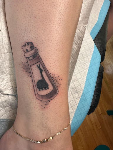 Explore foo fighters tattoo ideas, creative tattoo ideas in Hayward, available at Three Tentacles Tattoo Studio