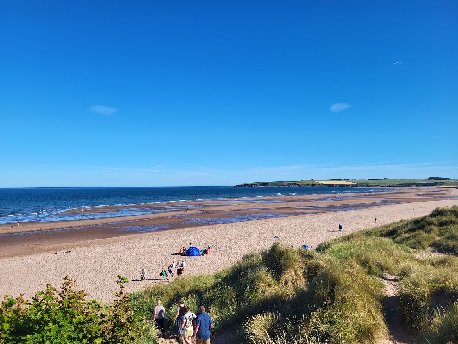 Photo of Lunan Bay Beach with bright sand surface