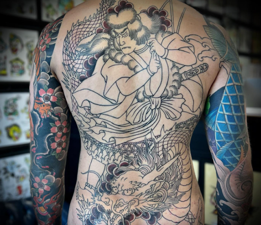 Explore anime leg tattoo ideas, creative tattoo ideas in Virginia Beach, available at Salt Water Tattoo