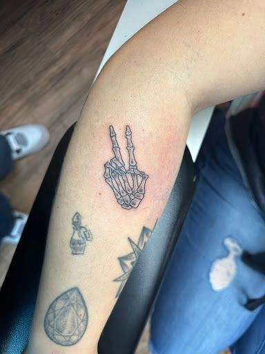 Explore ripped skin tattoo ideas, creative tattoo ideas in Hudson Falls, available at ALTERED ADDICTION TATTOOS