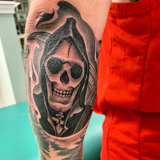 Explore snoopy tattoo ideas, creative tattoo ideas in Portsmouth, available at DNA Tattoo