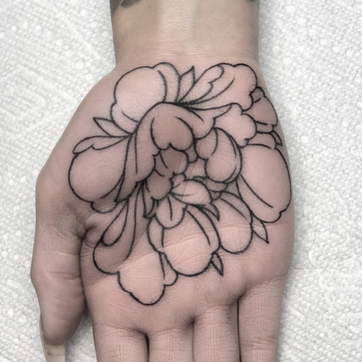 Explore lower back tattoo ideas for men, creative tattoo ideas in Loveland, available at R&G Body Art