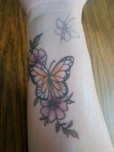 Find angel tattoo ideas for guys for your next unique tattoo in New Hampton at Crescent Moon Tattoo