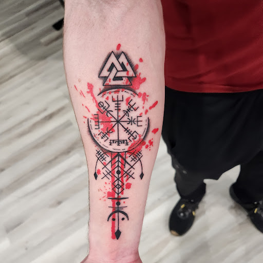 Explore religious elbow tattoo ideas, creative tattoo ideas in Toledo, available at Ink and Iron Tattoo Parlour and Gallery