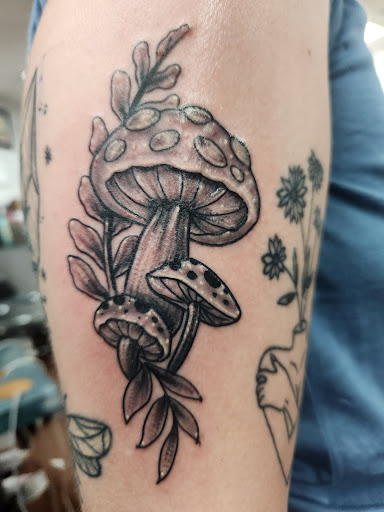 Explore street sign tattoo ideas, creative tattoo ideas in Rogers, available at Saved by Grace Tattoo Studio