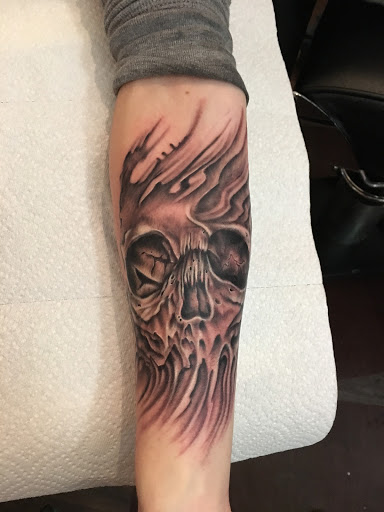 Explore lower back tattoo cover up ideas, creative tattoo ideas in Kingsford, available at Deft Tattoo Studio