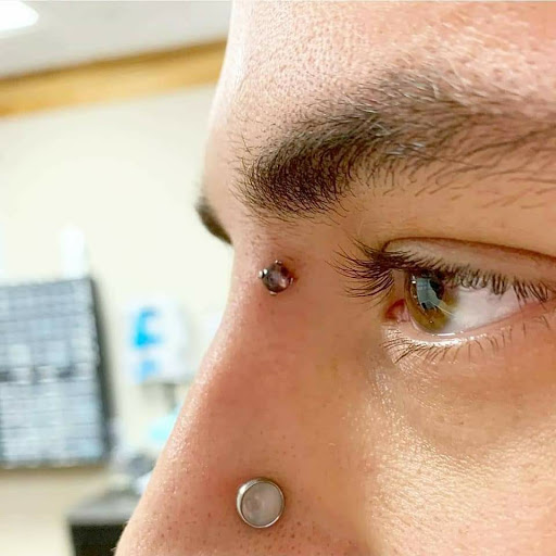 Explore red ink tattoo ideas, creative tattoo ideas in Charleston, available at Exotic Impressions Body Piercing