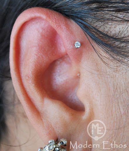 Explore dog tag tattoo ideas, creative tattoo ideas in New Cumberland, available at Modern Ethos Piercing