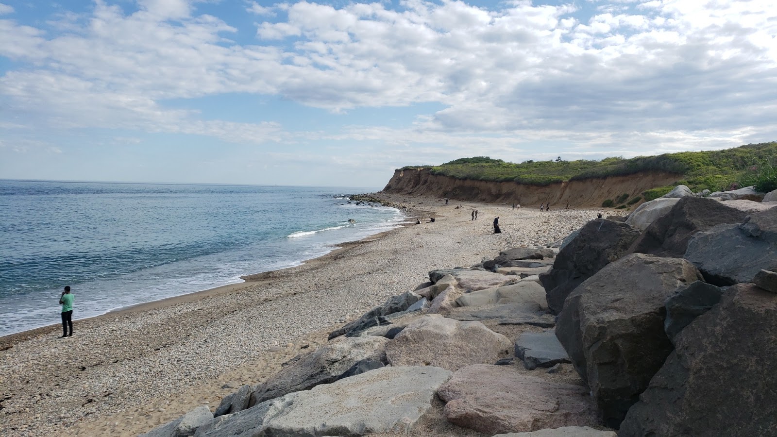 Photo of Montauk Lighthouse with blue pure water surface