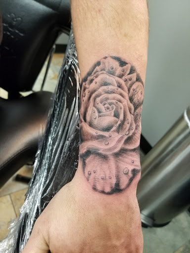 Explore rose tattoo ideas for women, creative tattoo ideas in Kansas City, available at Divine Tattoo Parlor