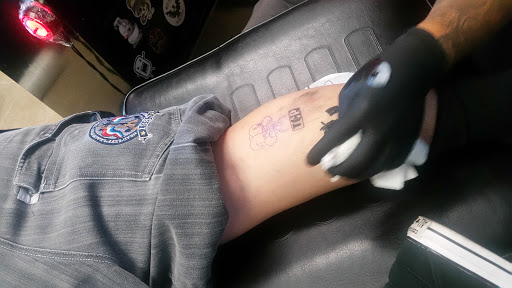 Explore wrestling tattoo ideas, creative tattoo ideas in Phoenix, available at Slow N Low Tattoo And Body Piercing