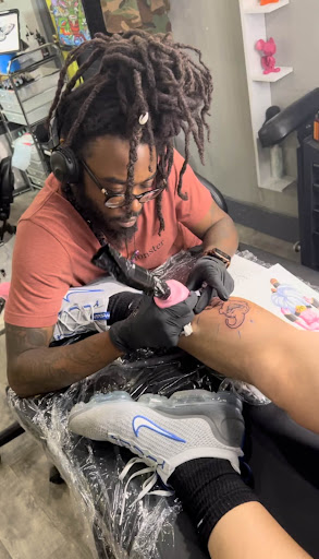 Explore banner tattoo ideas, creative tattoo ideas in Atlanta, available at Iron Palm Tattoos & Body Piercing Atlanta