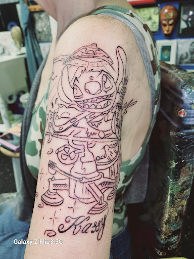 Explore tattoo ideas for arm, creative tattoo ideas in Englewood, available at The Original Big Daddy Tattoo & Body Piercing est.1997 est.1997