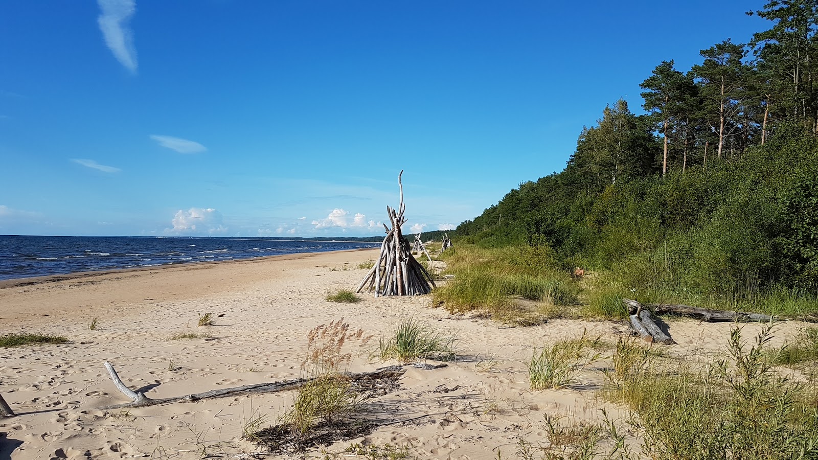 Foto von Incupes nudistu pludmale mit feiner beiger sand Oberfläche