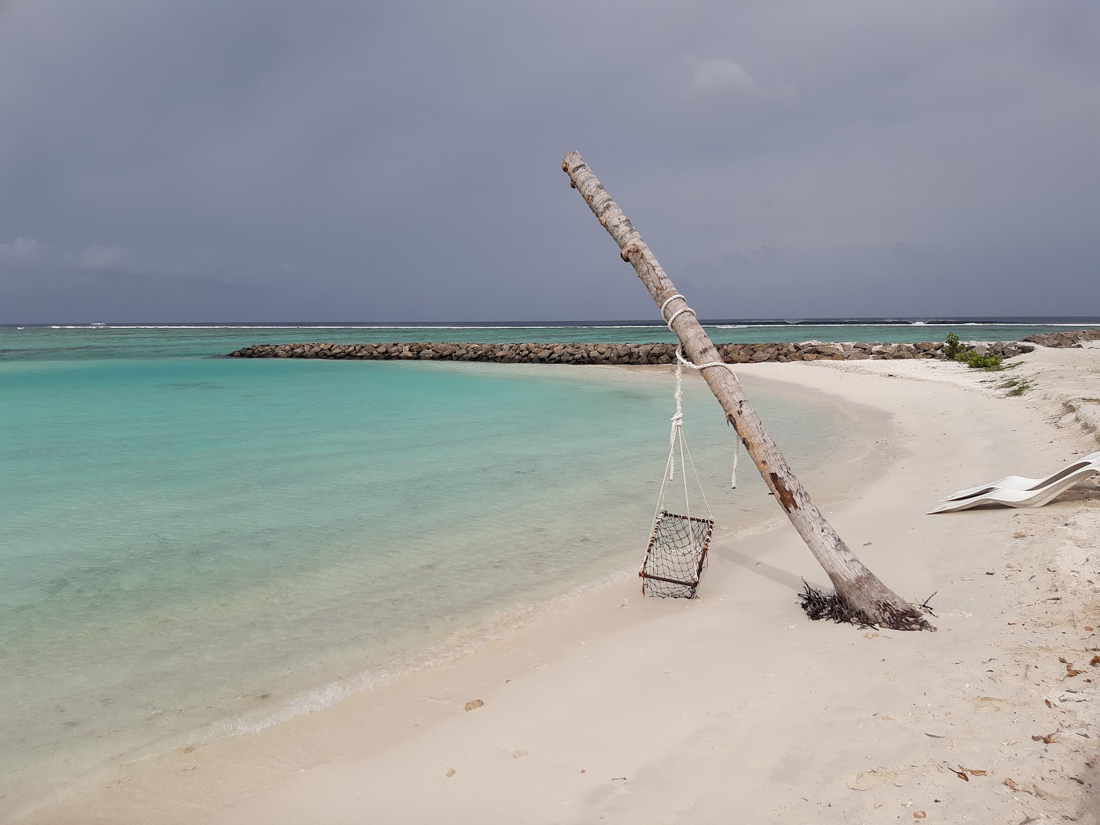Zdjęcie Huraa beach z powierzchnią beżowy piasek