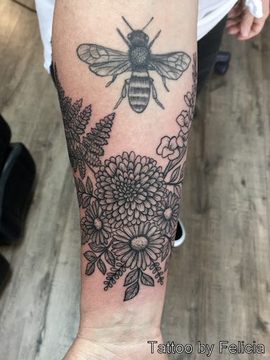 Explore women's cover up tattoo ideas, creative tattoo ideas in Fort Myers, available at Tiger Lotus Tattoo and Piercing