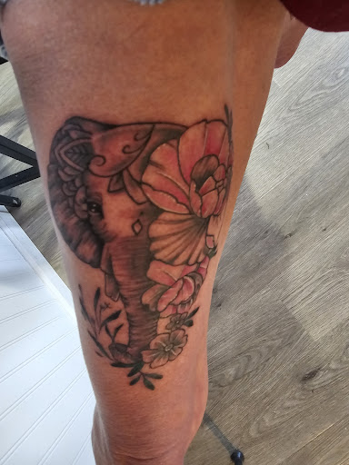 Explore flower ankle tattoo ideas, creative tattoo ideas in Loveland, available at Single Needle Tattoo